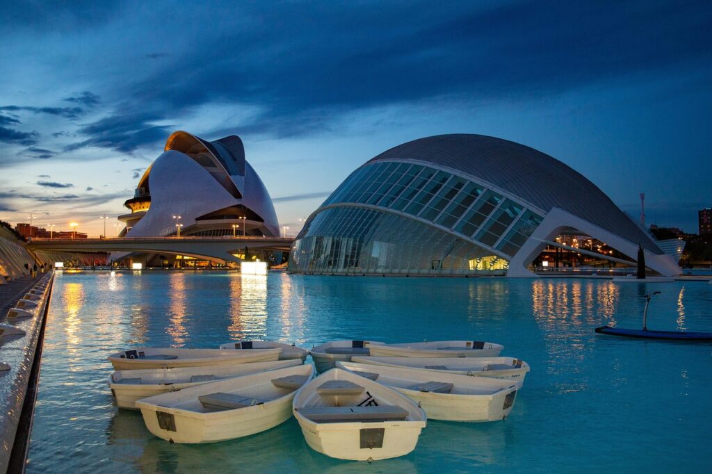 Futuristic white architecture of the City of Arts and Sciences reflected in water