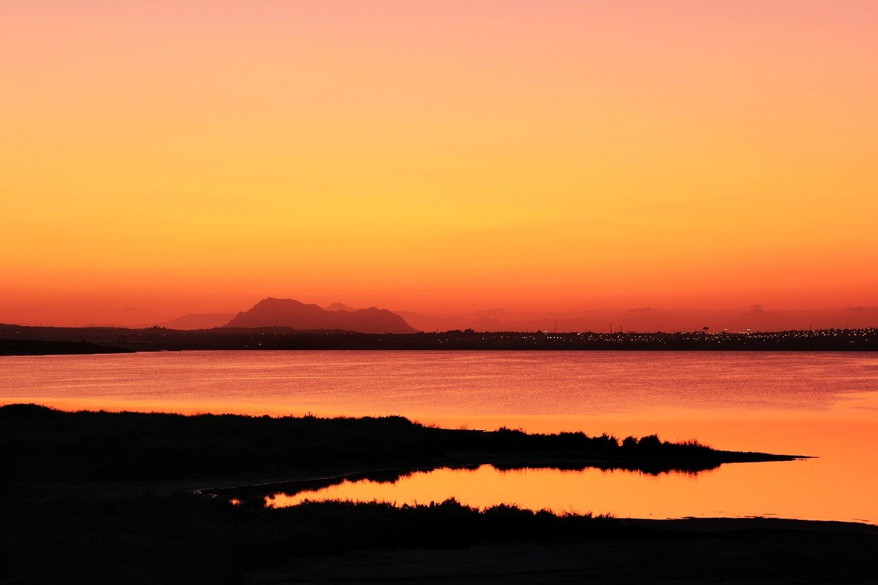 Aerial view of the bright pink Torrevieja salt lake